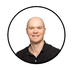 Doctor Scott McEvoy head shot. Doctor McEvoy is wearing a black shirt and smiling.